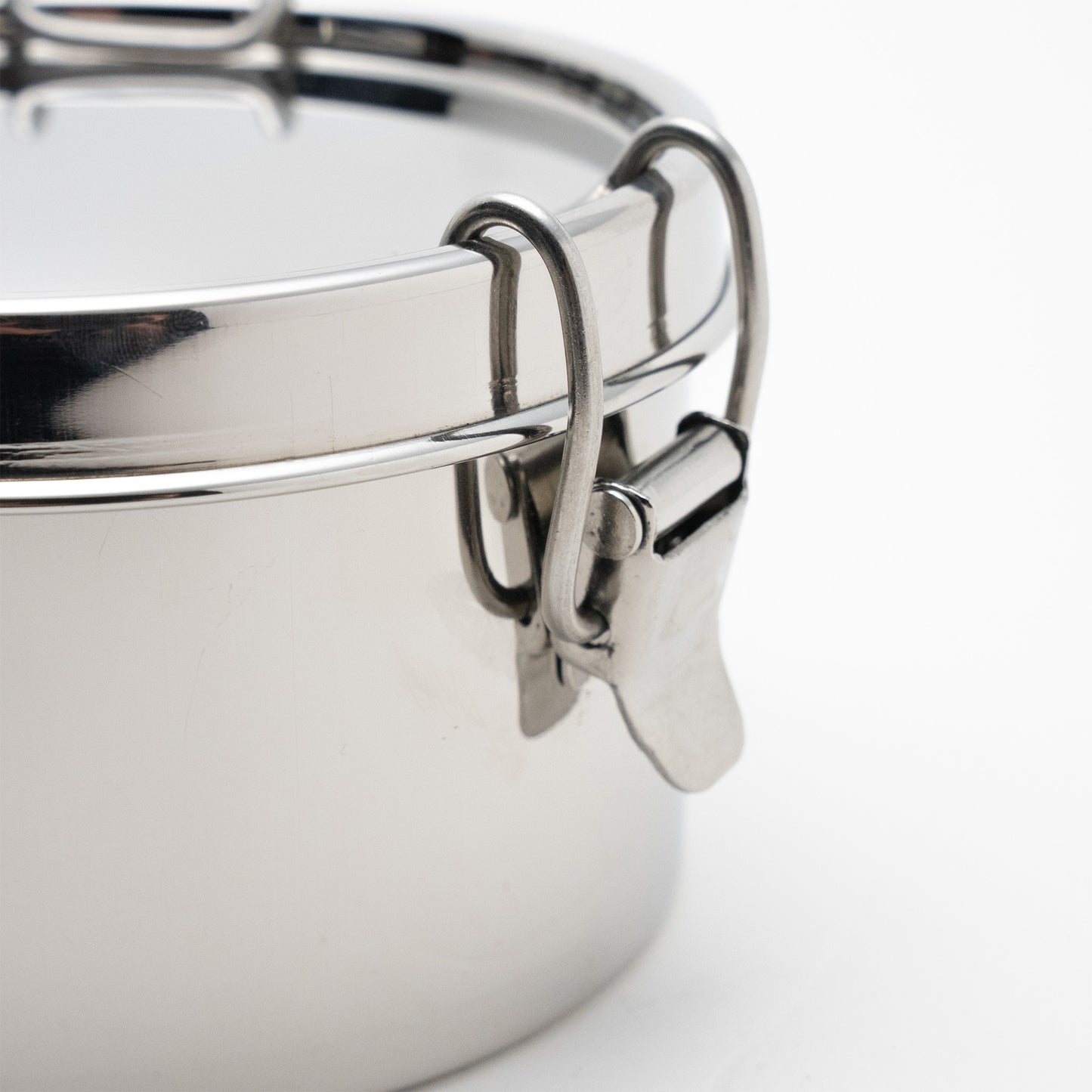 close up of a stainless steel clamp of a lunch box