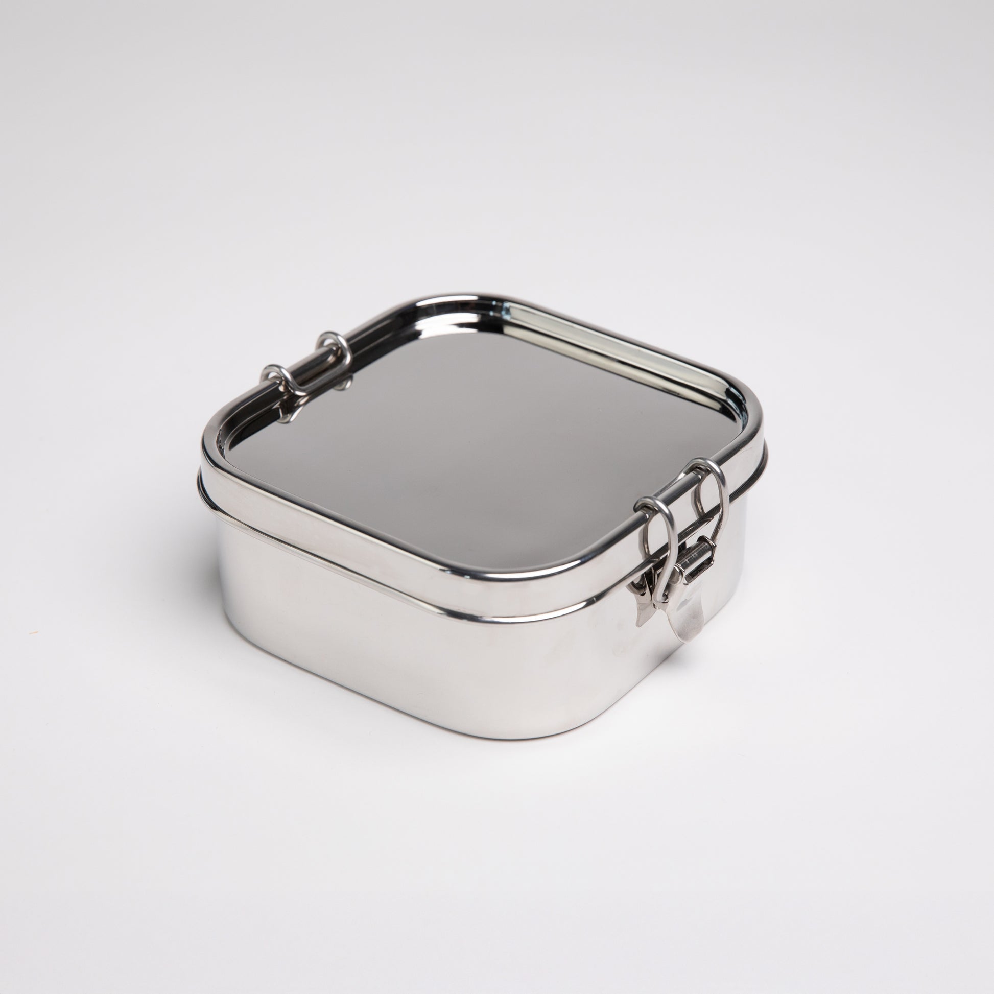 Leakproof stainless steel lunch box on a white surface