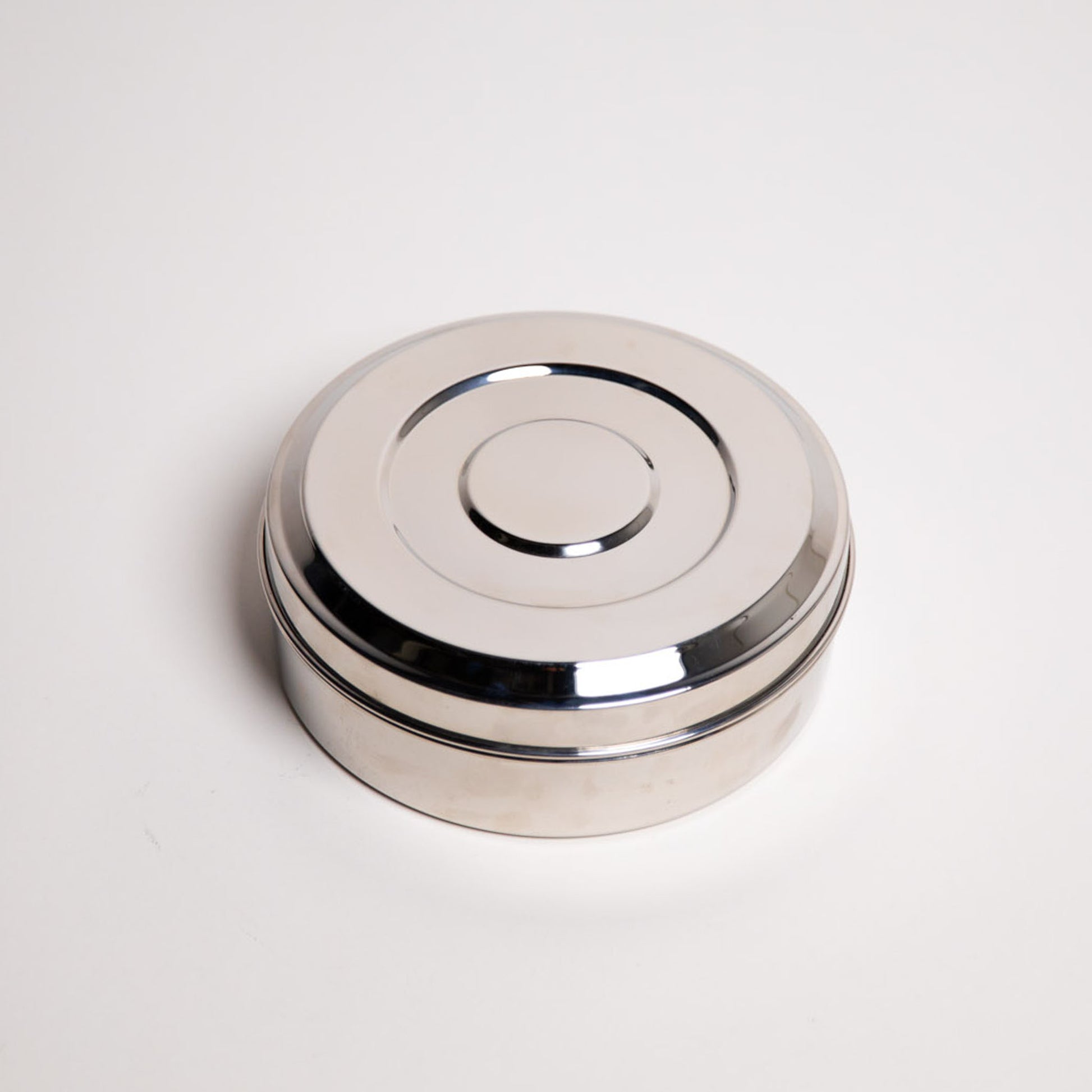 Small dense masala Dabba on white background 