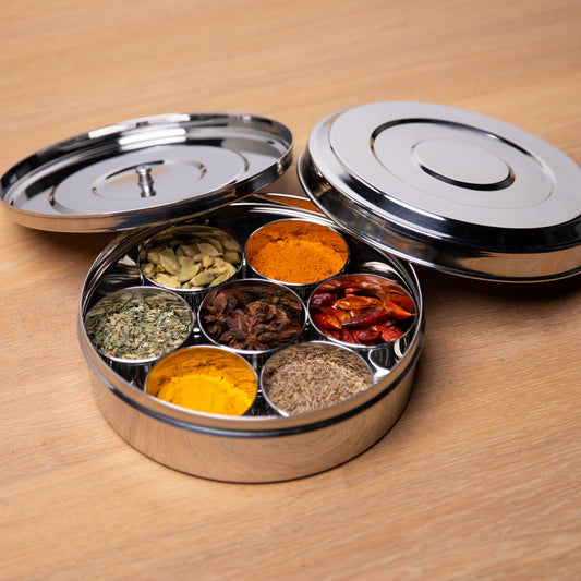 Masala Dabba open on a table with lids