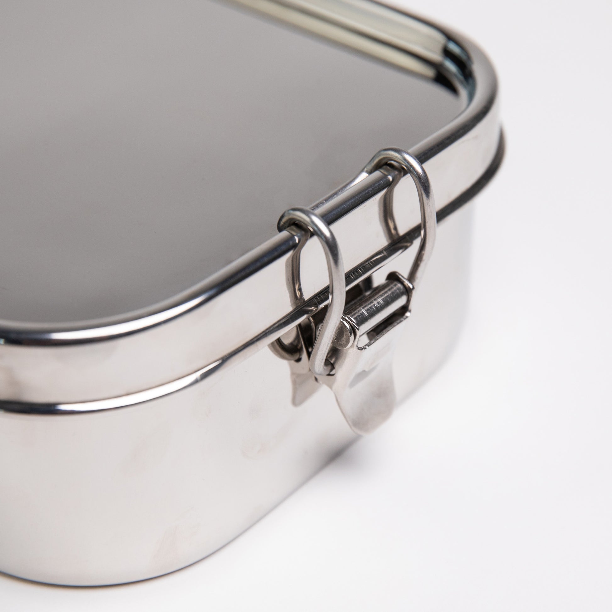 Close up of a stainless steel lunch box clip