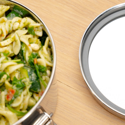 Piece of a stainless steel lunch box and the lid