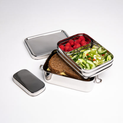 Stainless steel lunch box with snack box filled with lunch on a white background 