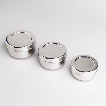Three stainless steel snack boxes from the Talli brand