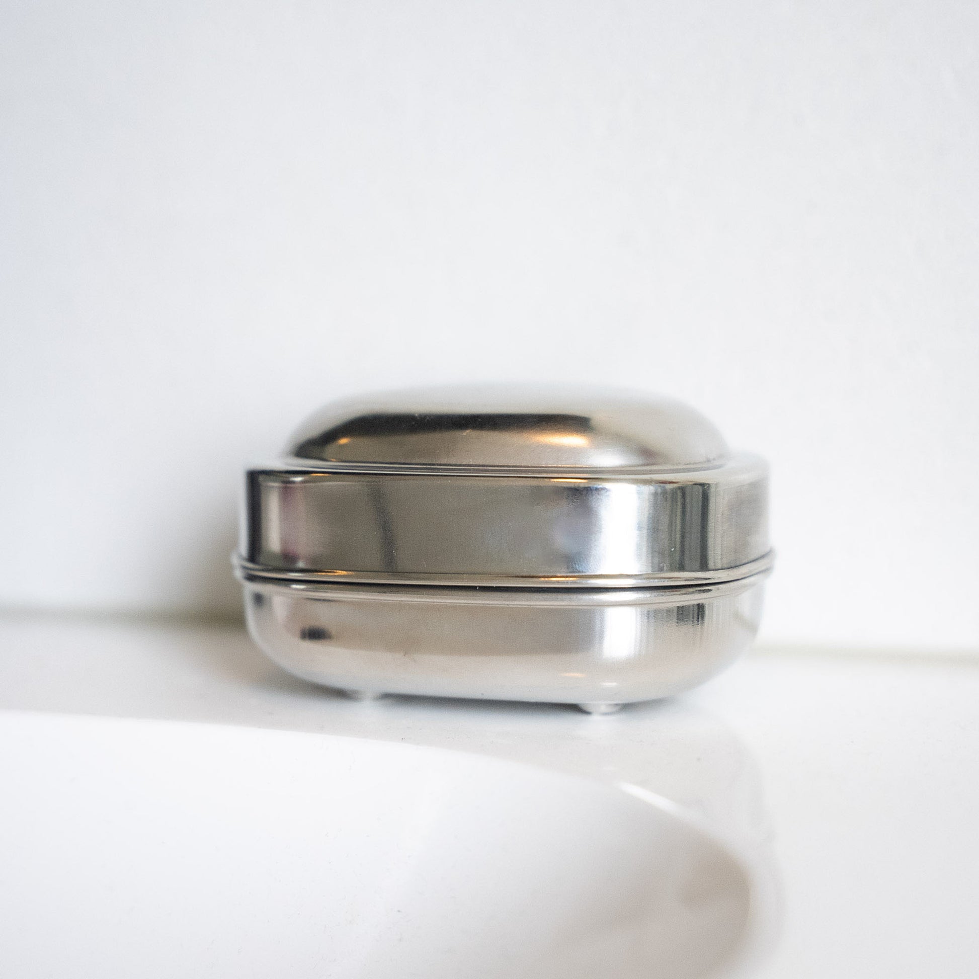 Stainless steel soap dish closed in bathroom