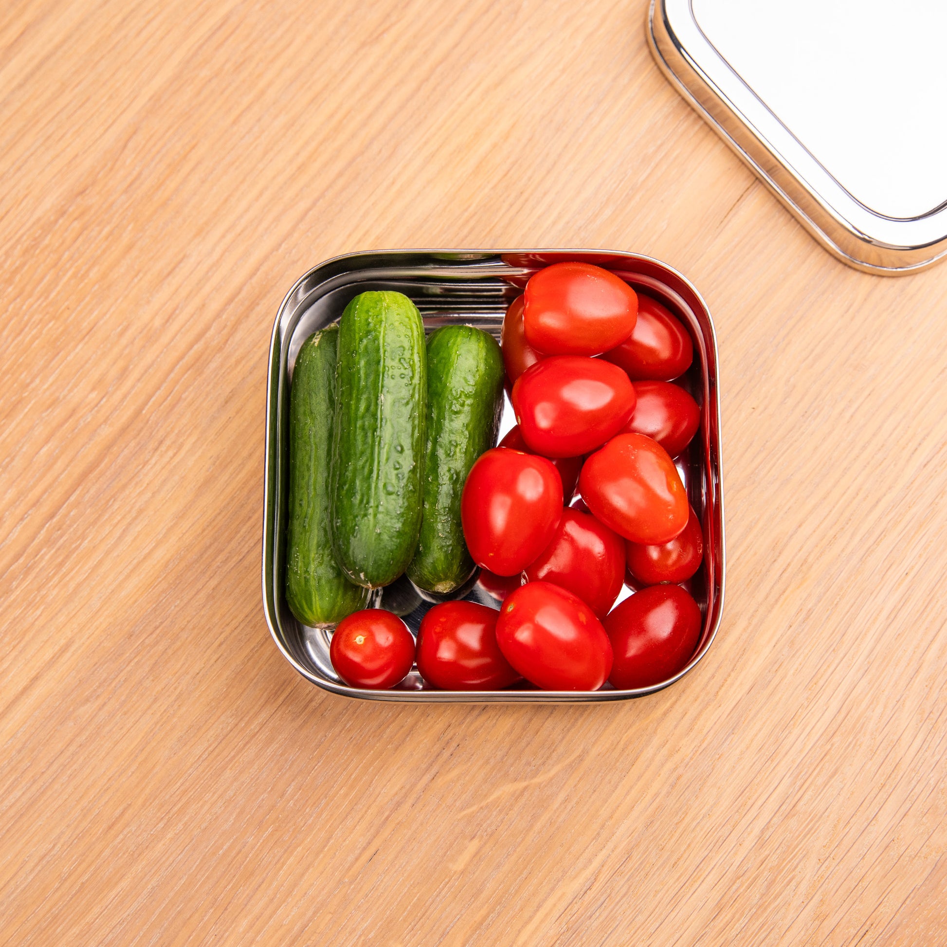 Healthy stainless steel snack box filled with vegetables