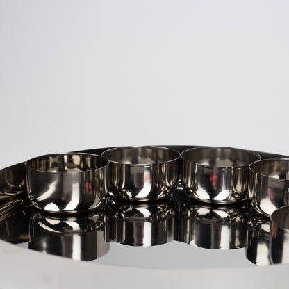 close up of 4 bowls on a thali plate 
