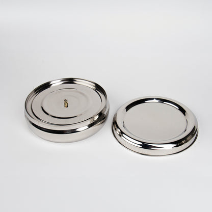 masala dabba and lid, with white background