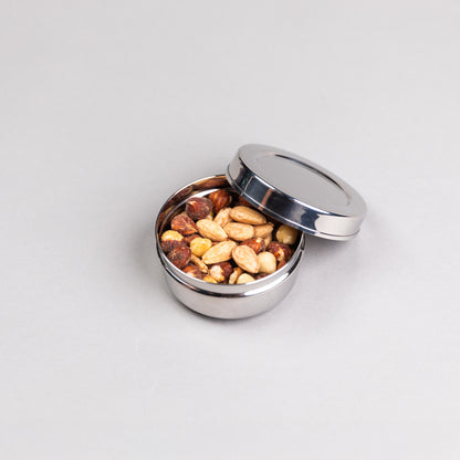 1 round stainless steel snack box filled with nuts