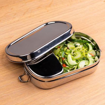 Stainless steel lunch box and snack box filled with lettuce and cucumber