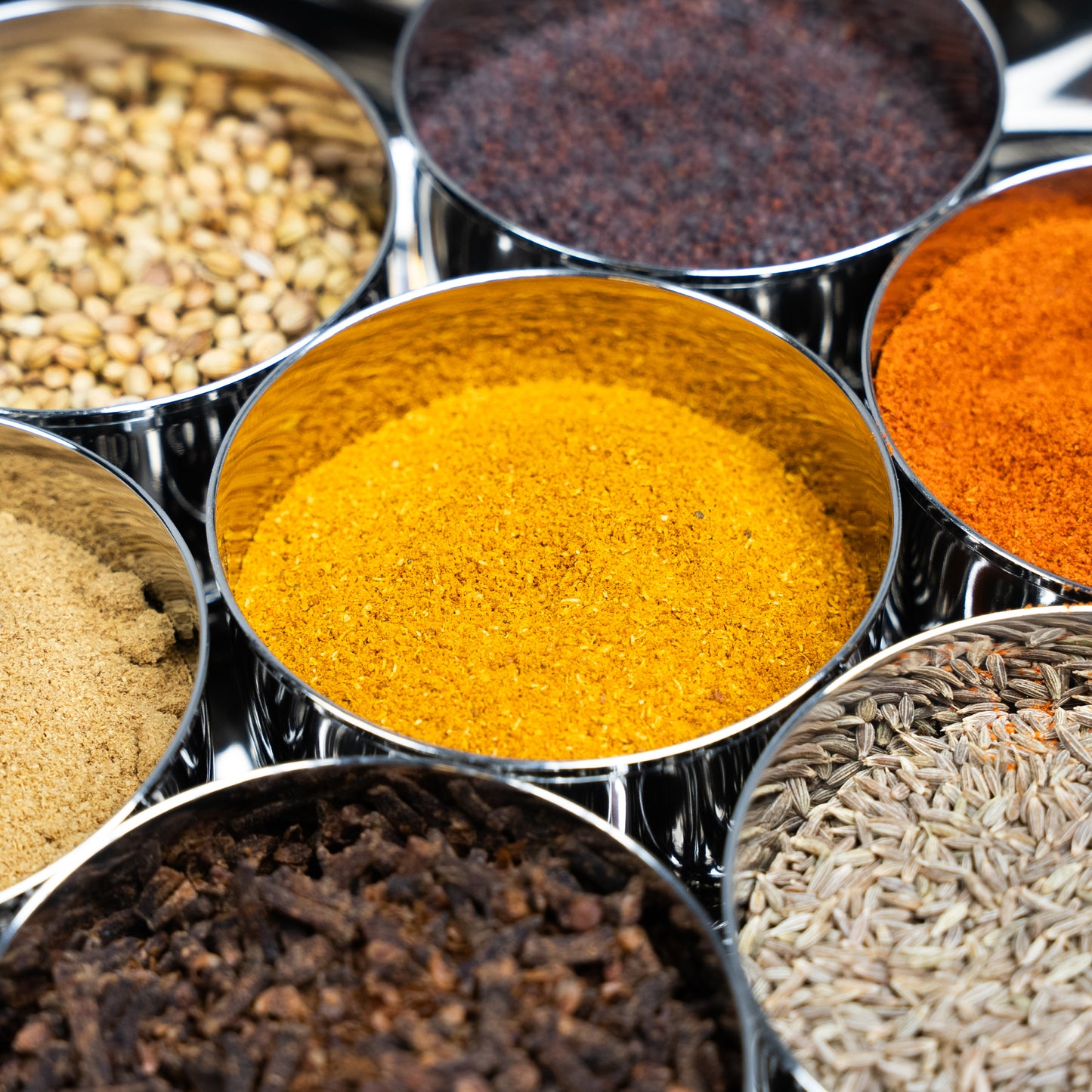 close up of spices in an indian spice box