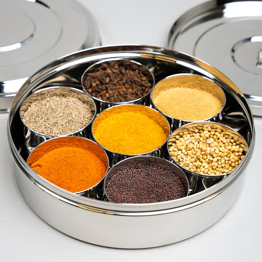 masala dabba filled with Indian spicebox containers