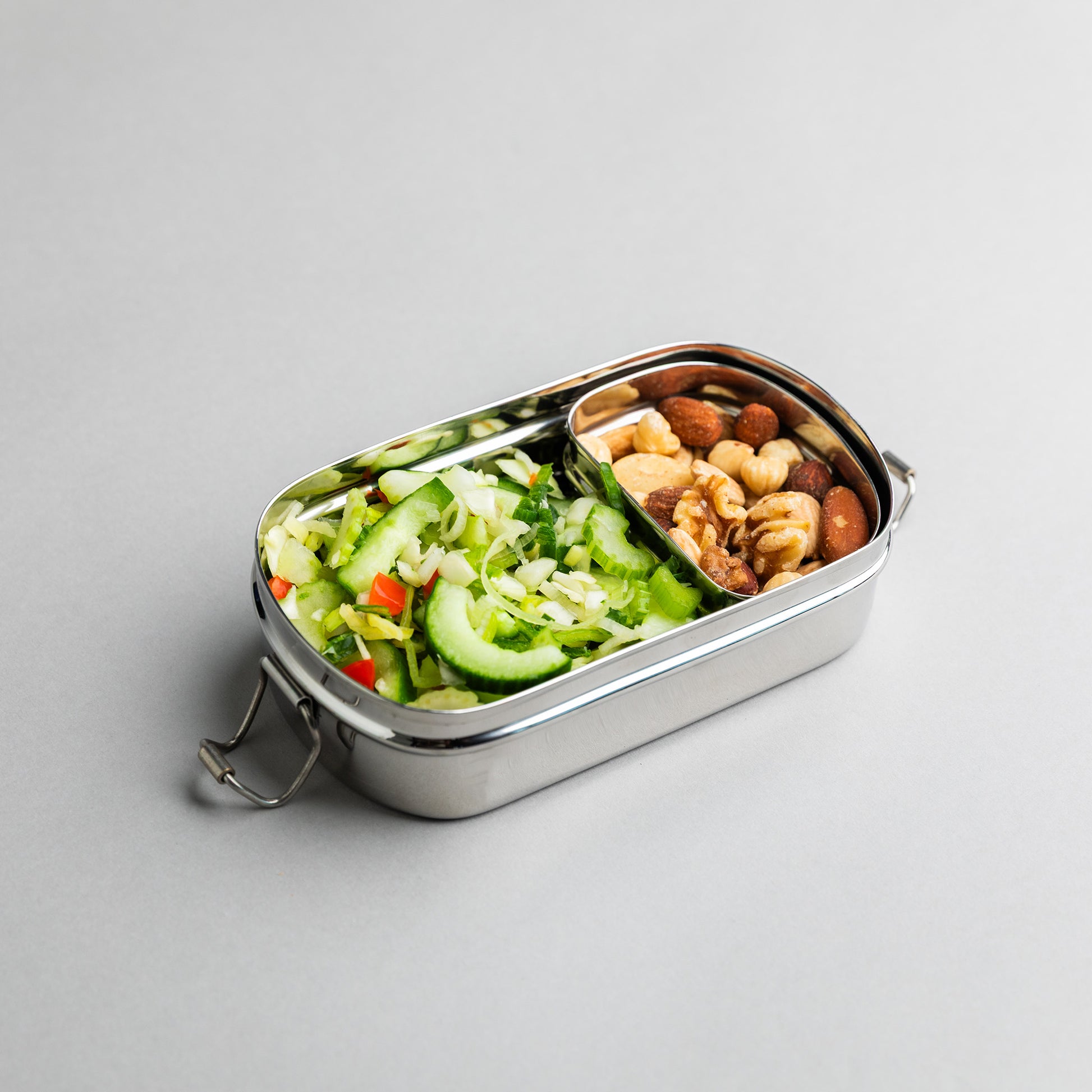 Stainless steel bento lunch box filled with a healthy meal