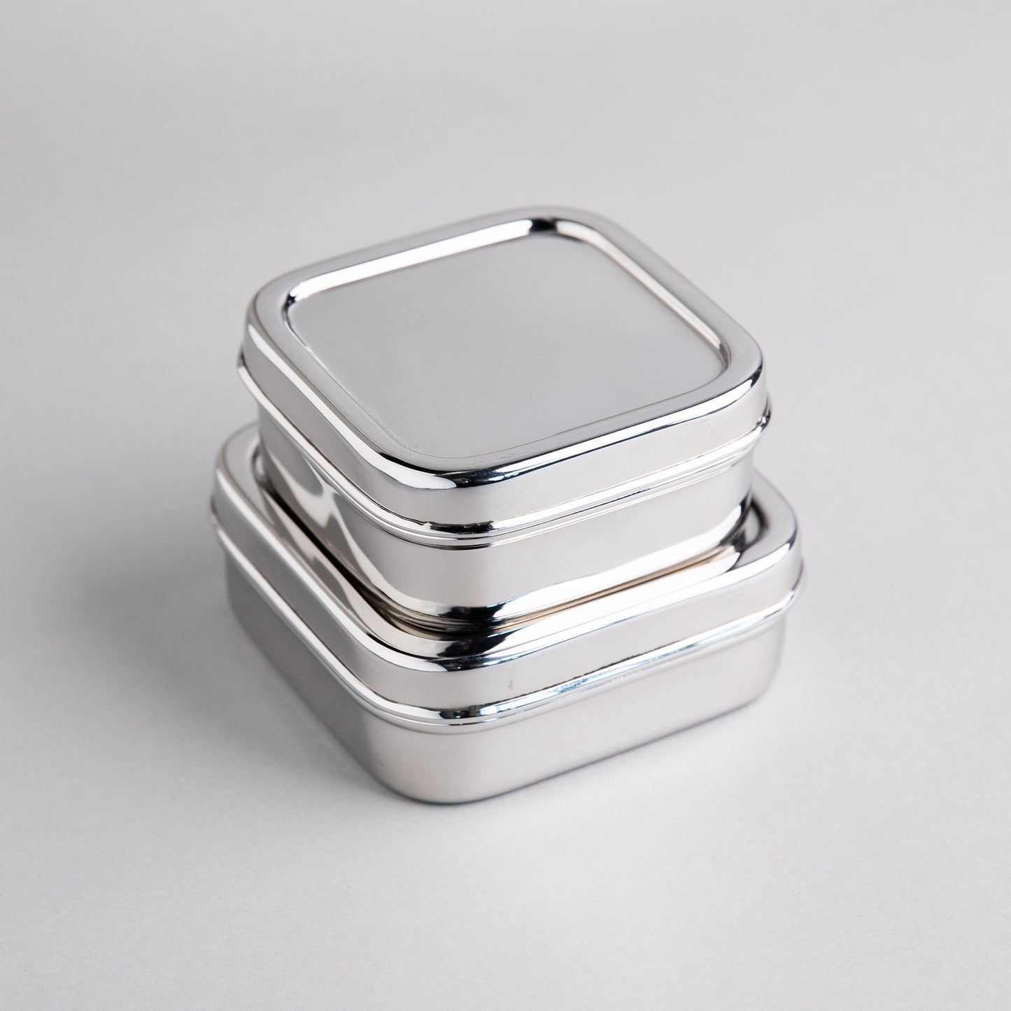 2 stainless steel fruit containers on top of each other