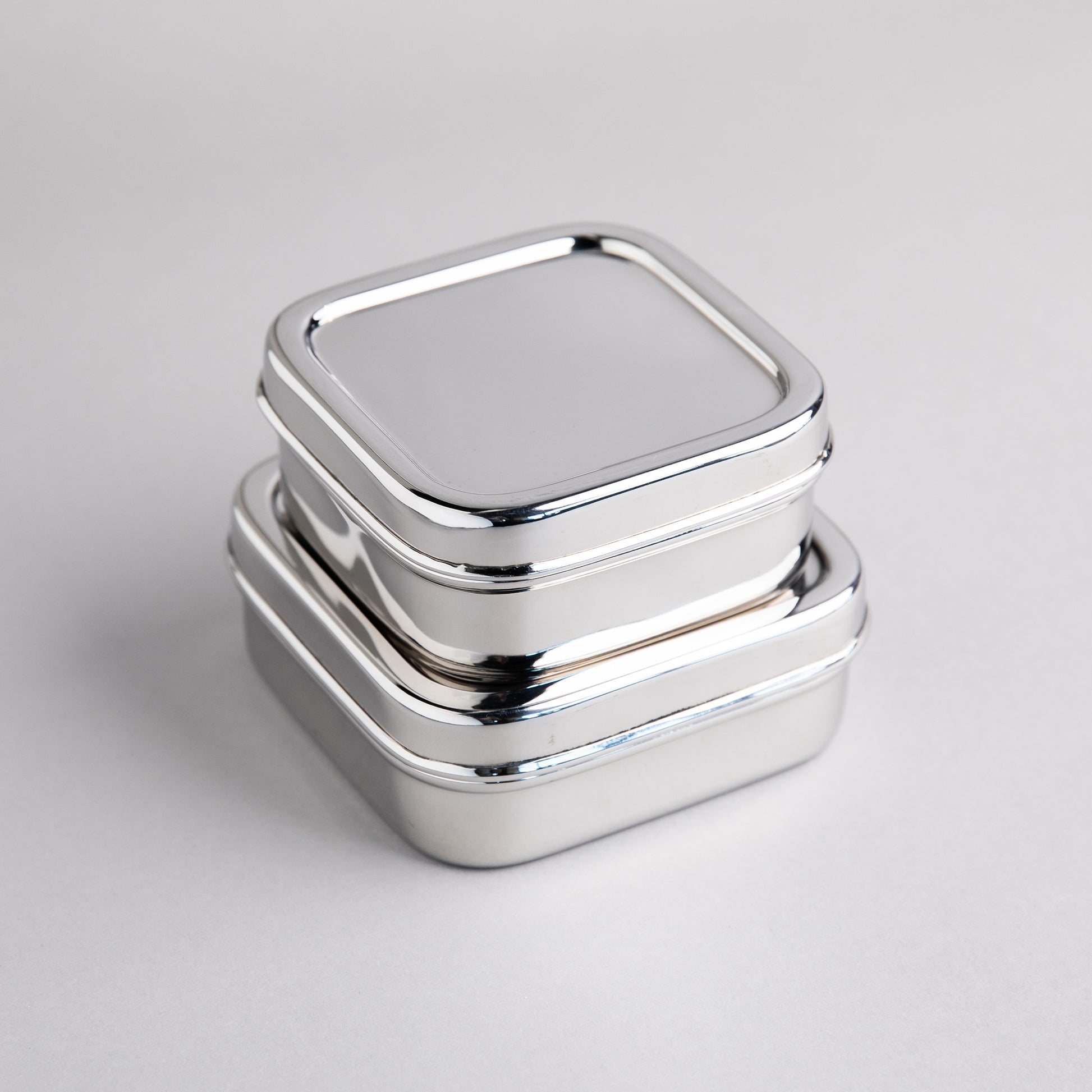 2 stainless steel fruit containers on top of each other