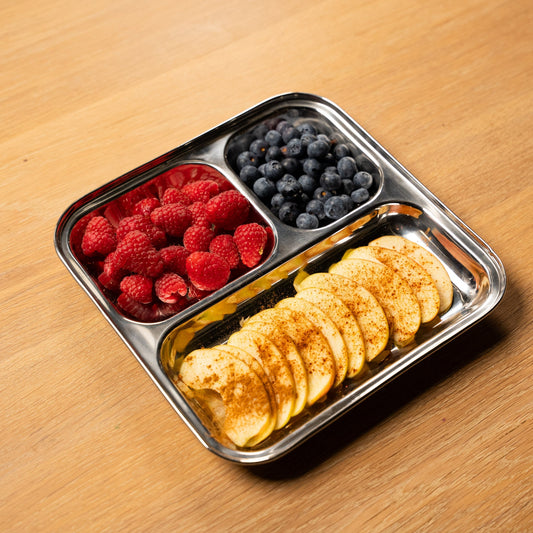 square stainless steel plate with compartments filled with fruit. ideal for barbecue 